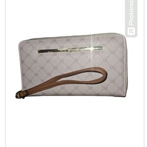 Steve Madden cream and tan wristlet. NWOT black inside. 8"L x 4.5"W